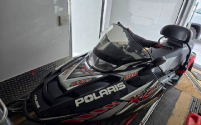 Photo of a 2005 & 2003 Polaris Snowmobiles With A Thule Snopro Three Place Trailer for sale